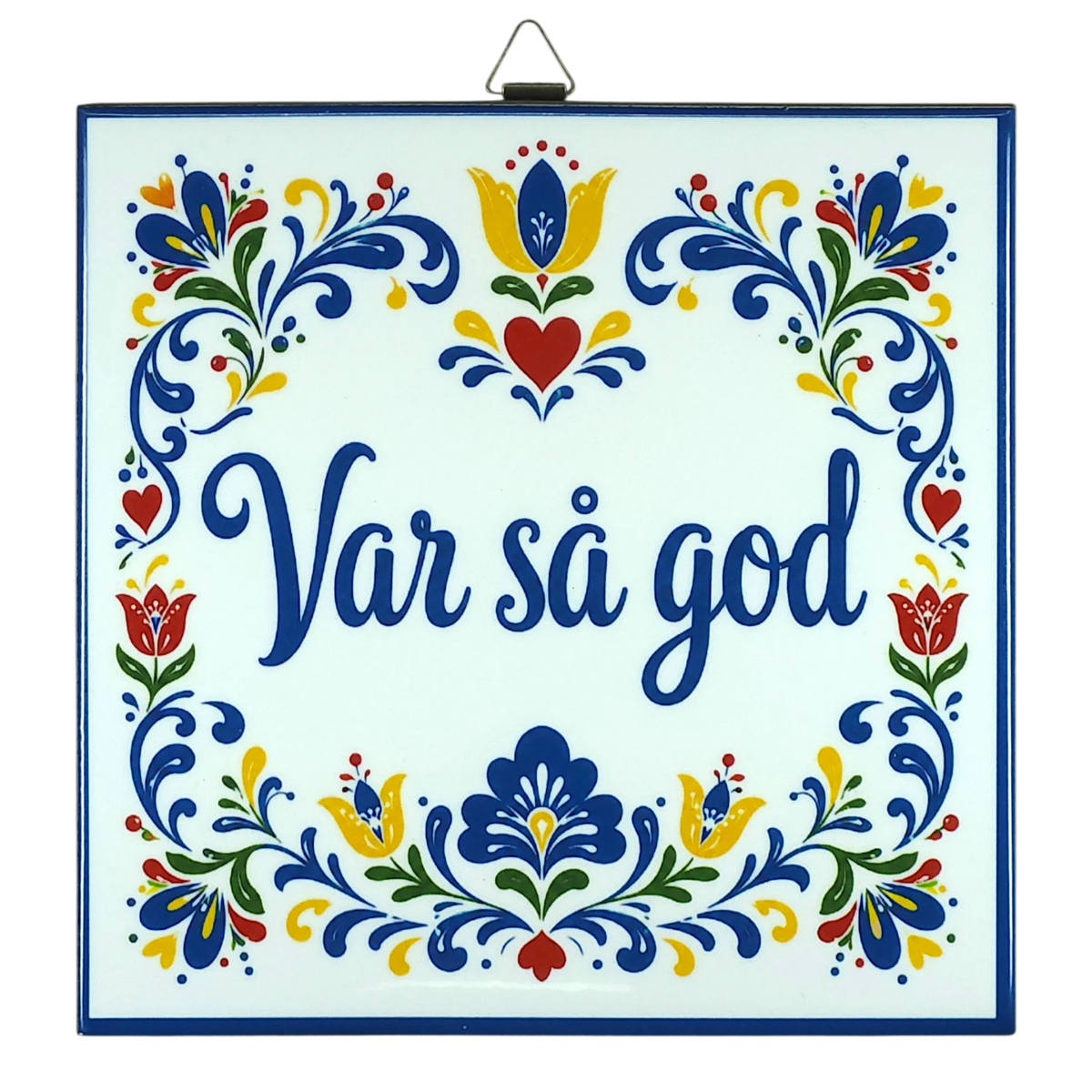 Cork-backed trivet with Norwegian and Swedish folk art patterns in blue, red, and yellow. The words “Var så god” are centered.