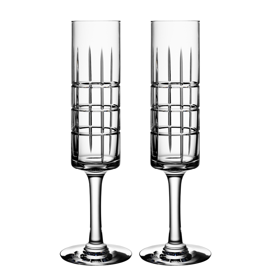 The Orrefors: Street Champagne Glass (2-Pack) by Jan Johansson features elegant geometric patterns, exuding sophistication and timeless style against a white background.