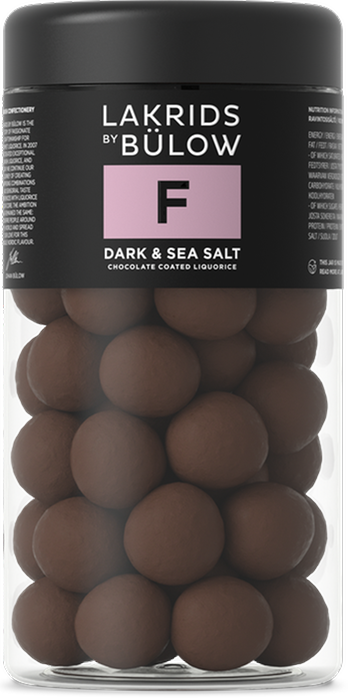 A clear jar of Lakrids by Bülow #F Dark & Sea Salt Danish Chocolate Coated Licorice (295g): round licorice candies coated in dark chocolate and sprinkled with sea salt.