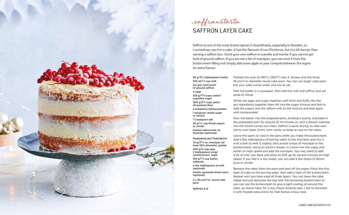 Saffron layer cake with white frosting and red berries on a cake stand, visible layers, Scandinavian style; recipe page placed next to the cake.