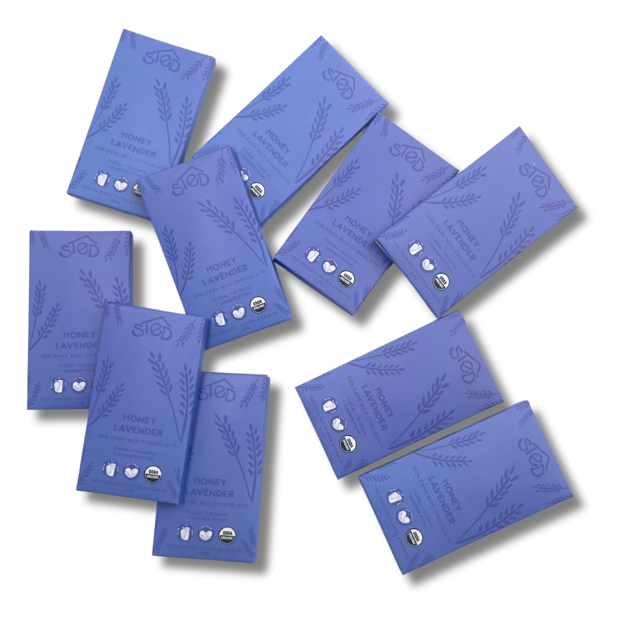 Ten purple chocolate bars with lavender illustrations and organic milk chocolate certification logos scattered on a white background.