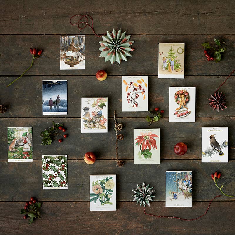 Ten charming Christmas cards featuring kids and a tree, with two festive designs by Koustrupco, come with envelopes—ideal for use as Scandinavian Christmas cards or mini gift cards.