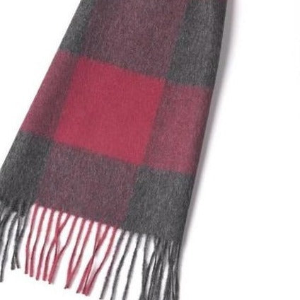 The Scarf: Luxury Square Red 100% Baby Alpaca Wool Scarf features a red and dark gray checkered pattern with elegant fringed ends, crafted from pure baby alpaca wool for a luxurious touch.