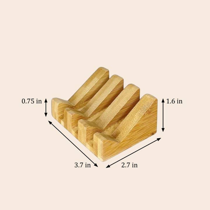 Rectangular bamboo soap holder with four parallel drainage slots, natural finish, and compact dimensions of 3.7 x 2.7 x 1.6 inches.
