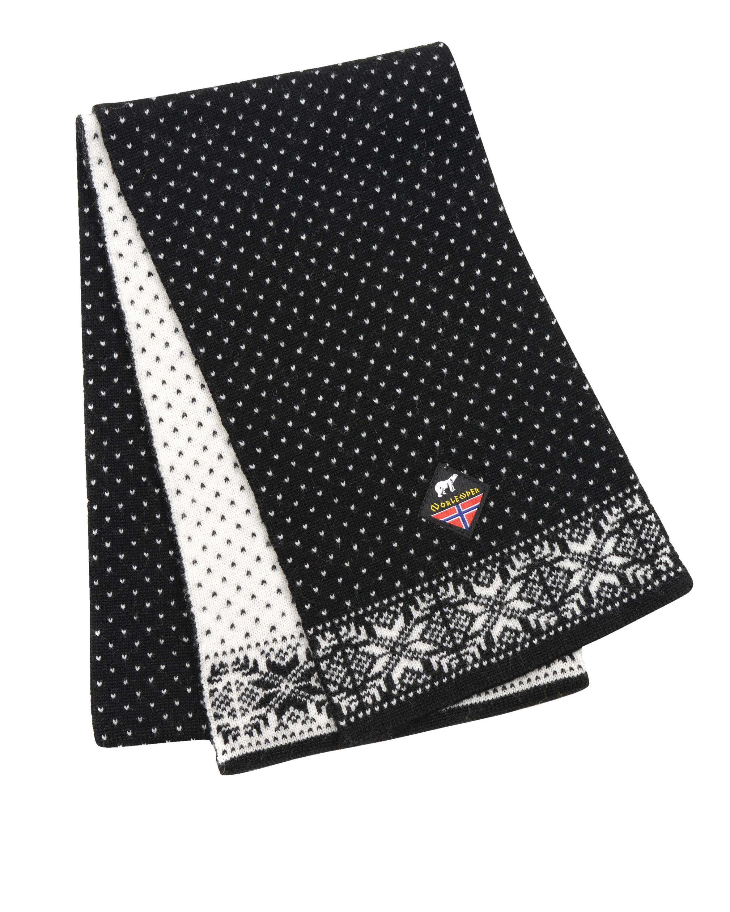 The Snowflake Norwegian Wool Black & White Scarf features a dotted pattern, snowflake design at the end, and a small logo patch, inspired by traditional Norwegian knitwear.
