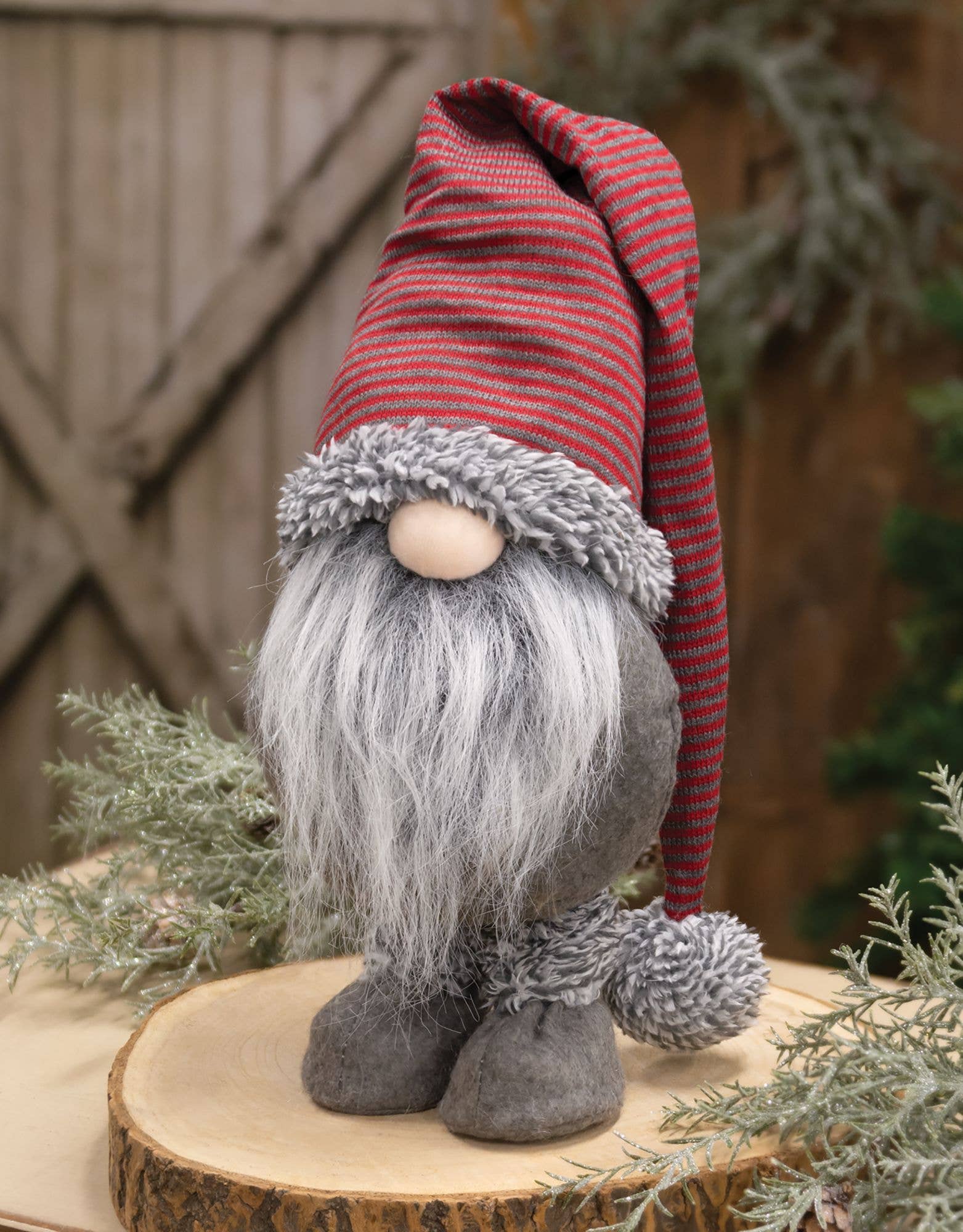 The Gnome: Red/Gray Striped Gnome w/Dangle Hat Tomte (Nisse) stands 14" tall, featuring a long gray beard and round nose—ideal for Christmas holiday decor on any surface.