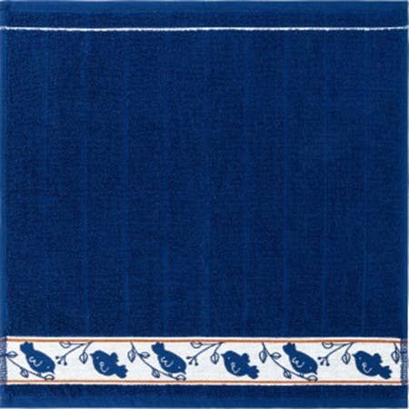 Square cotton towel in dark blue with a horizontal white border patterned with blue birds on branches.