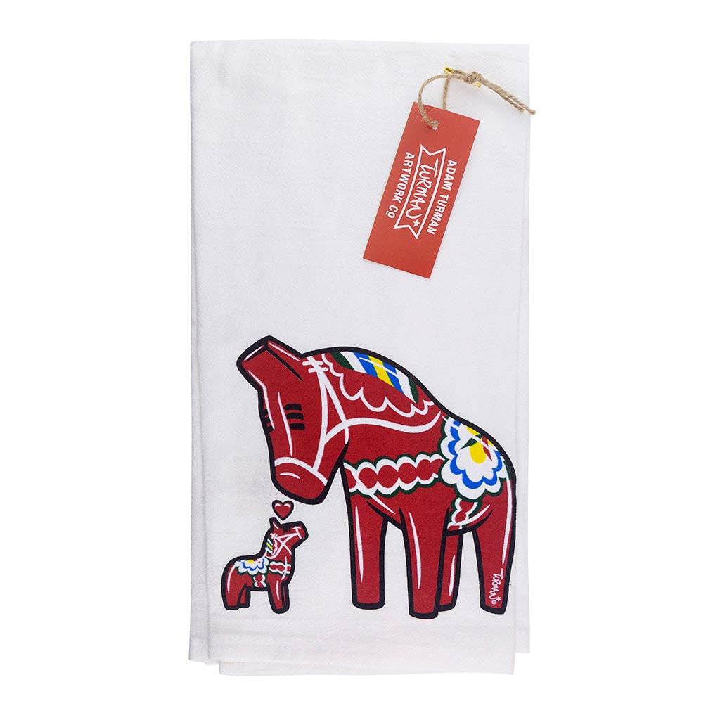 Tea Towel - Dala Horse "Jumbo" by Adam Turman features large and small red Dala Horses with folk patterns; perfect Swedish kitchen decor, red tag at top.