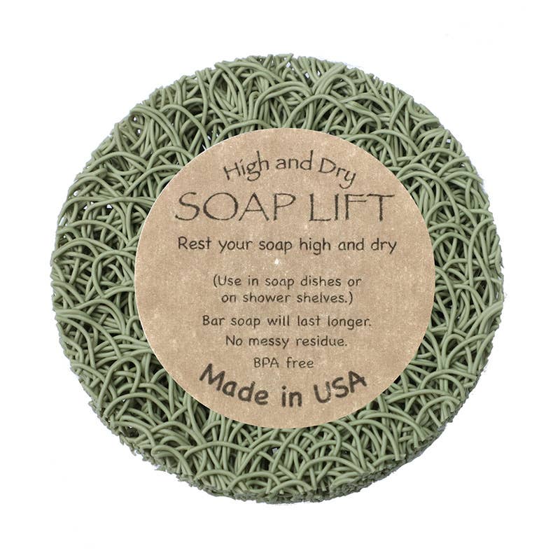Round Sage Soap Lift® with a label that reads: High and Dry SOAP LIFT. Keep your soap elevated on shower shelves. Made in the USA with eco-friendly bioplastic.