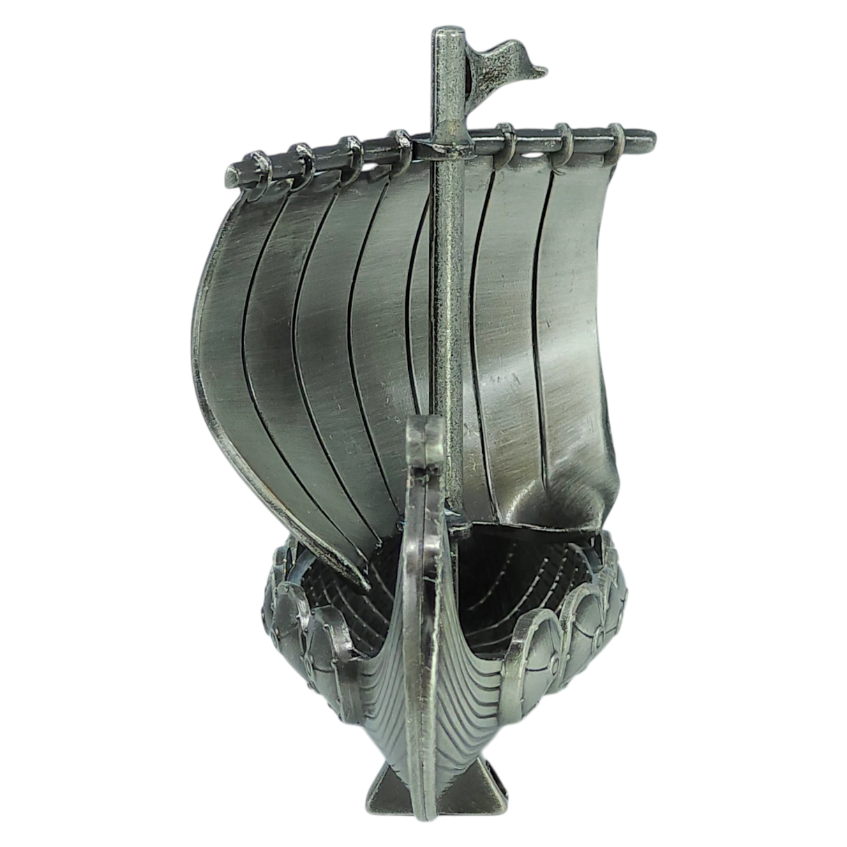 Front view of the Faire - Scandinavian Specialties Figurine: Norwegian Viking Ship with Sail Pewter 5″x3″ Table Decor, this handcrafted metallic model features a single sail, curved hull, and engraved details, proudly showcasing Scandinavian heritage against a plain white background.