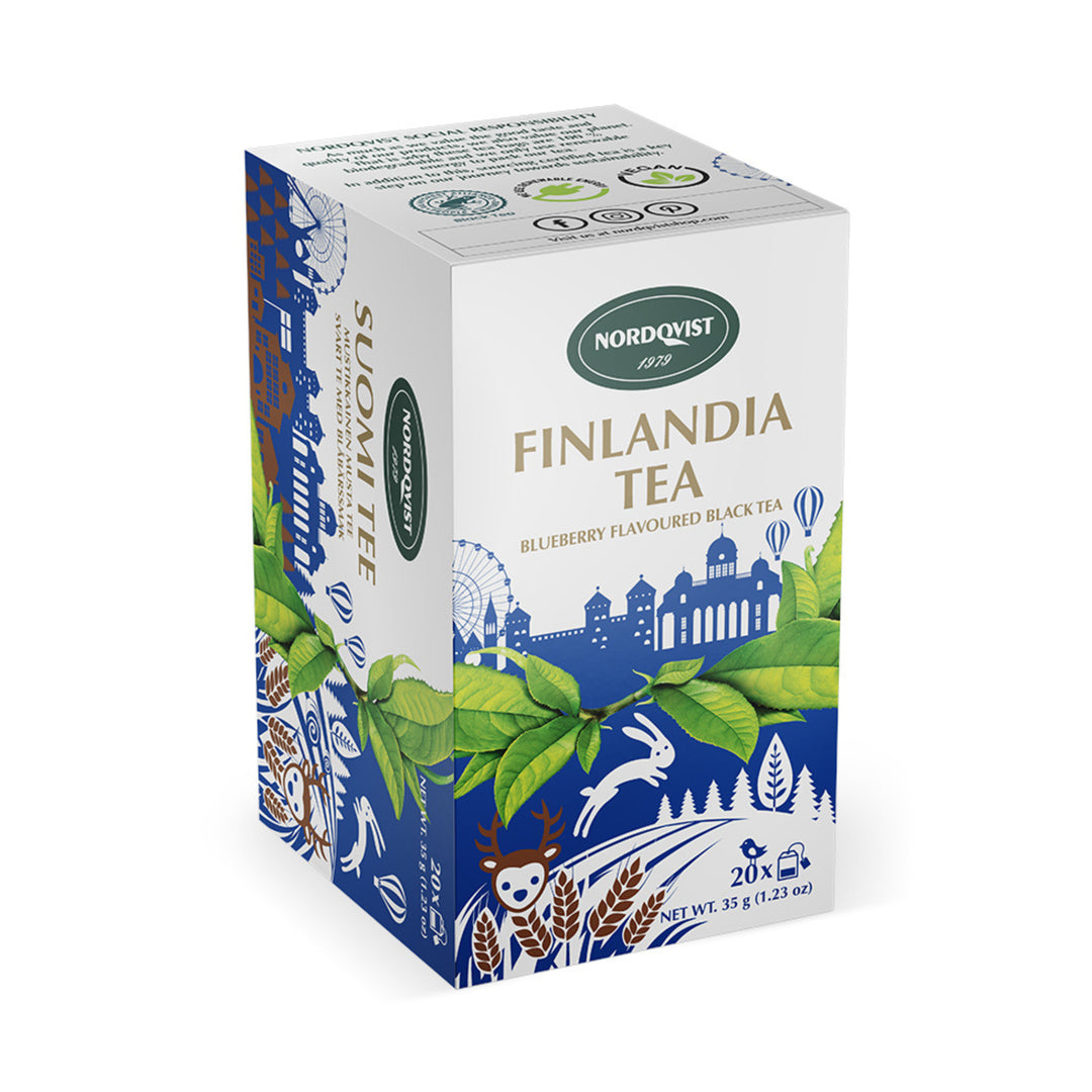 A box of Nordqvist Blueberry Flavored Black Tea (20 bags, 1.23oz), featuring packaging with green leaves and blue illustrations of Finnish scenery and wildlife.