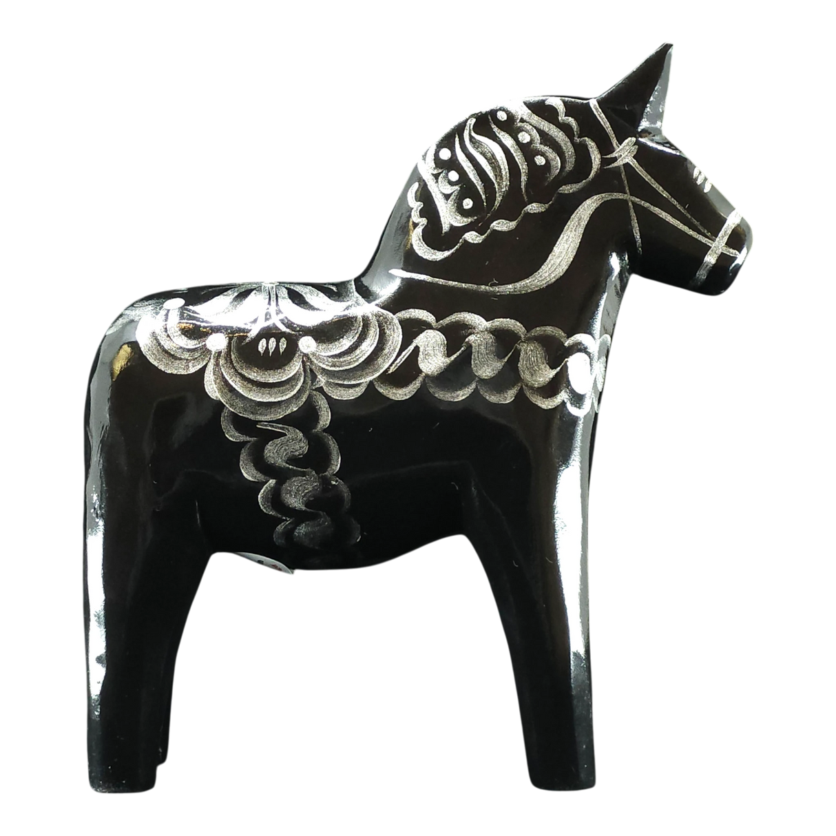 The Dala Horse: Black & Silver "Celebrate Series" by Grannas Olsson is a 13 cm handcrafted Swedish figurine, featuring silver patterns on black wood and inspired by traditional folk art.