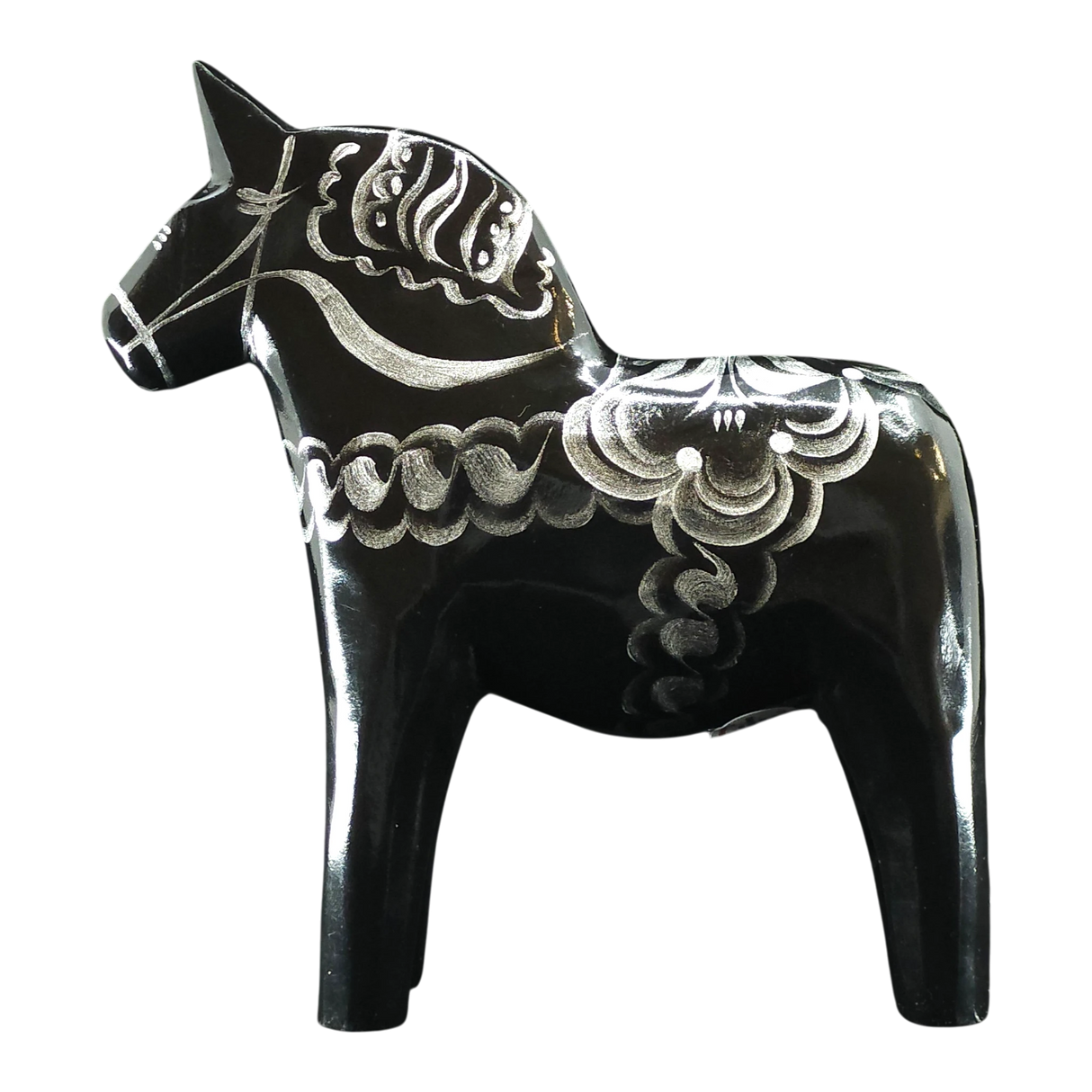 The Grannas Olsson Dala Horse: Black & Silver "Celebrate Series" is a 13 cm Swedish figurine, handcrafted in wood with silver decorative patterns, standing on four legs. Made by Grannas Olsson in Sweden.