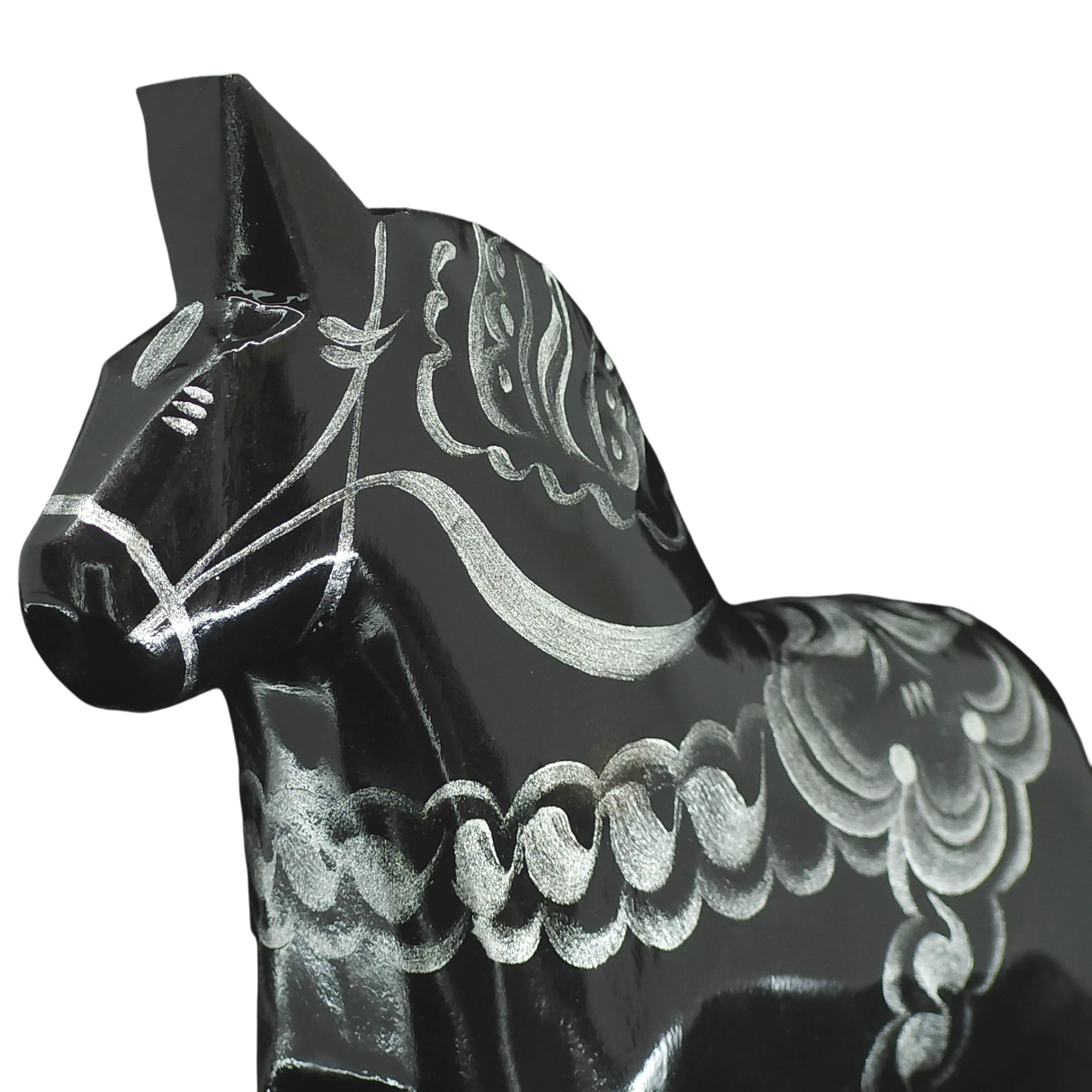 A close-up of the Grannas Olsson Black & Silver Swedish Dala Horse "Celebrate Series" (13 cm), handcrafted in Sweden, featuring detailed silver patterns on its body, displayed against a plain white background.