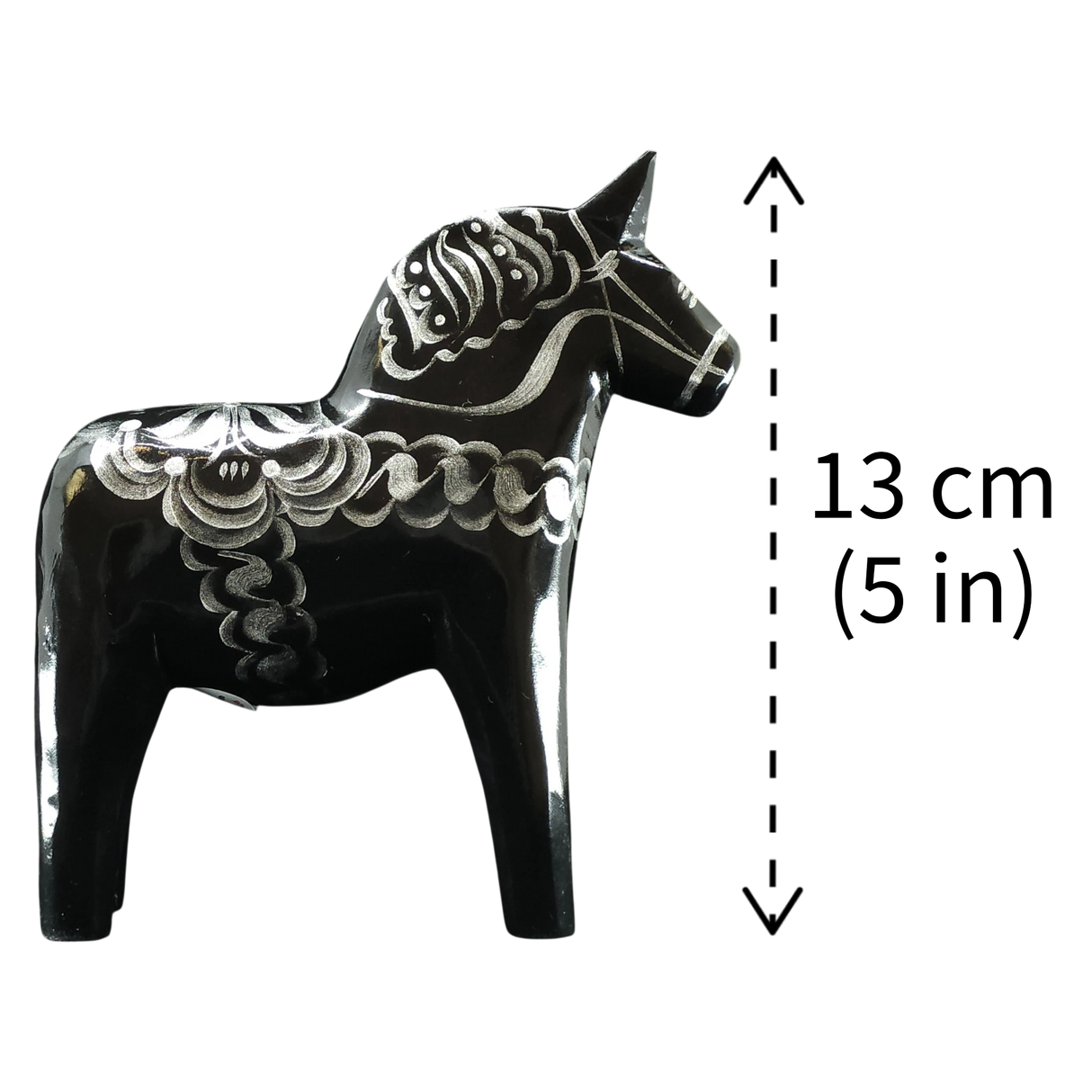 The Grannas Olsson "Celebrate Series" Black & Silver Swedish Dala Horse is a handcrafted 13 cm (5 in) figurine inspired by traditional folk art, featuring decorative patterns.