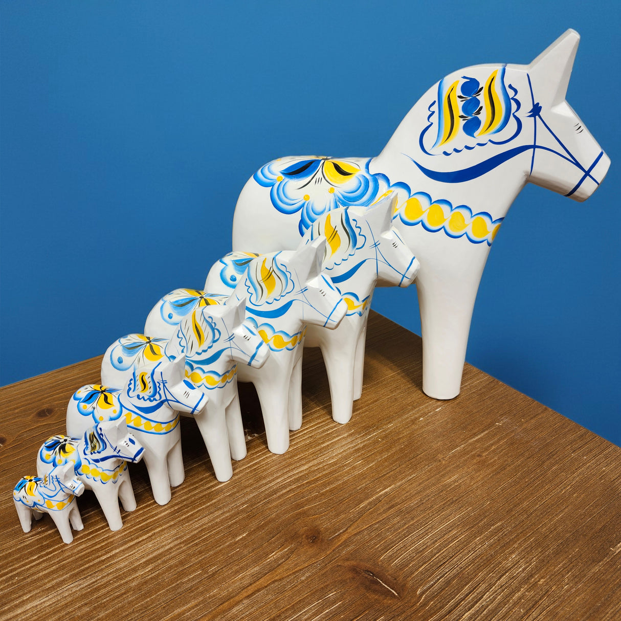 Dala Horse: White Swedish Dala Horse with Blue and Yellow "Swedish Flag Colors | Grannas A. Olsson Made in Sweden