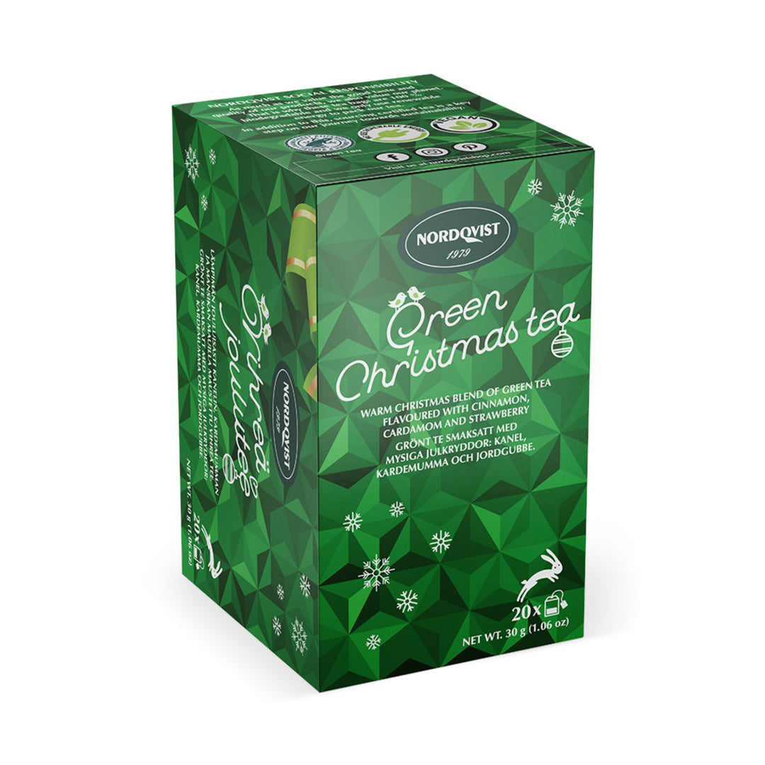 A green box of Nordqvist Green Christmas Tea (20 bags, 1.06oz) features festive designs and an ingredient list on the front.