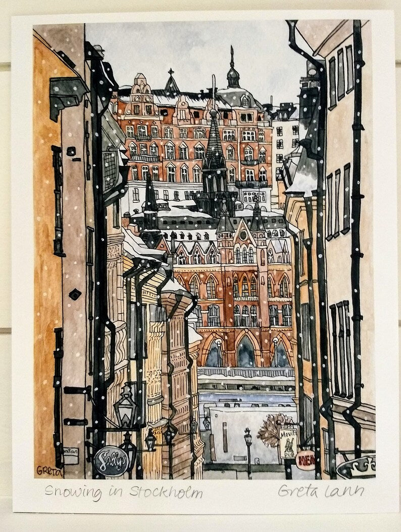 Snowing in Stockholm" by Greta Lann Signed Print captures a narrow street in Gamla Stan framed by historic buildings with falling snow—a charming winter cityscape perfect for art lovers.