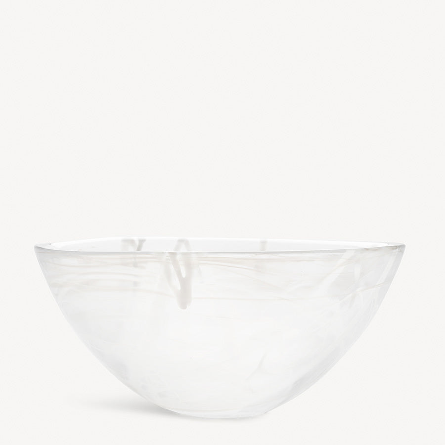 A KostaBoda Contrast Bowl in white with blue and black veining, designed by Anna Ehrner, is set against a plain, light background.