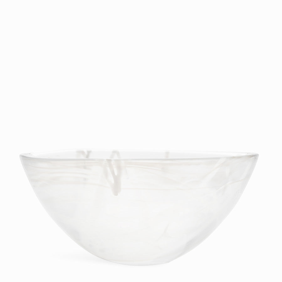The KostaBoda Contrast Bowl, designed by Anna Ehrner, showcases elegant white glass with striking blue and black veining, set against a plain white background.