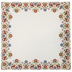 The Siljan Tablecloth Runner features a square white design with a colorful floral border and showcases vibrant Dala horses, flowers, and kurbits in red, yellow, and blue.