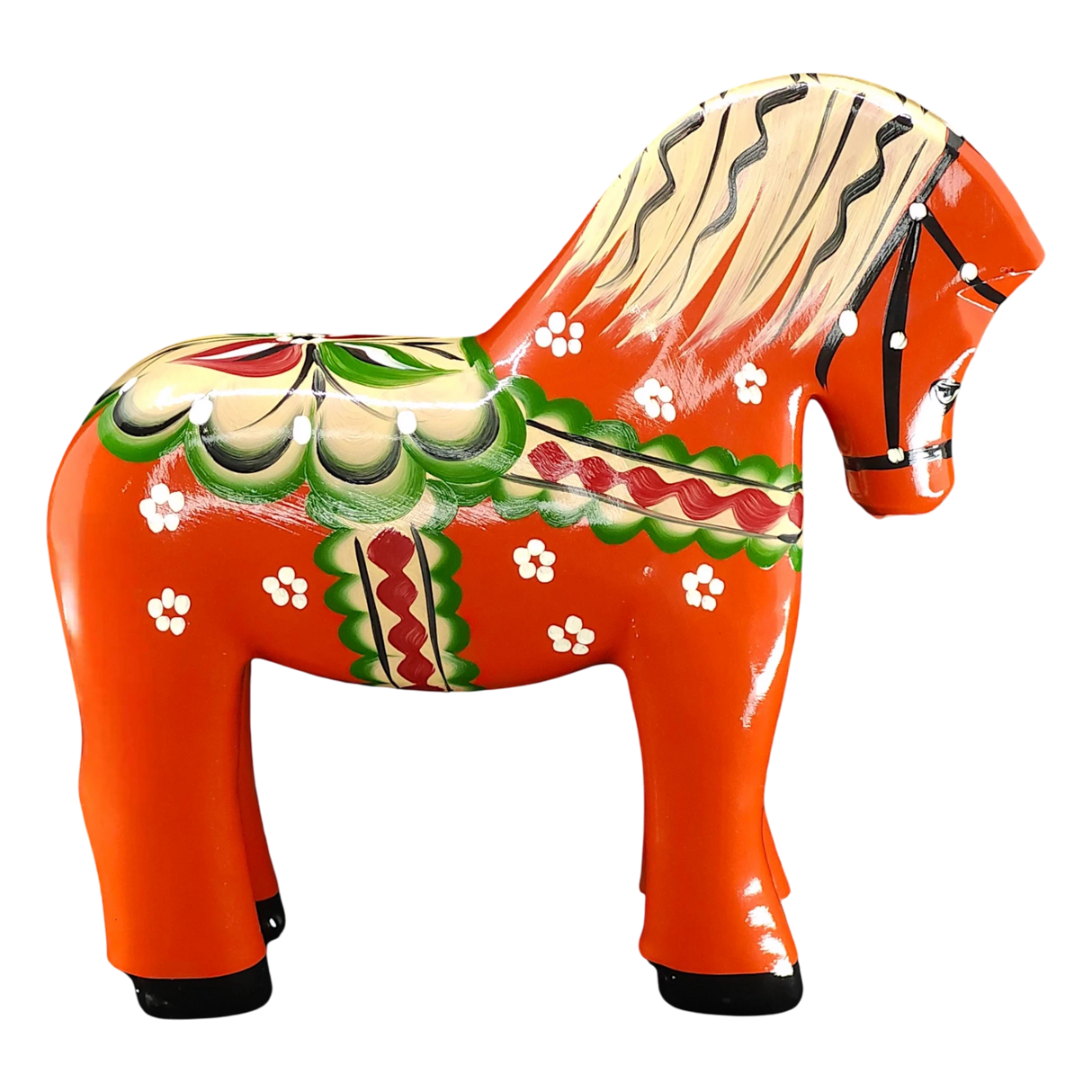 The Nils Olsson Red Swedish Dala Horse "Färnäshästen" (14 cm) is a handcrafted wooden figure painted with green, white, red, and yellow folk-art patterns—typical of Sweden’s decorative tradition. Made in Sweden by Nils Olsson.