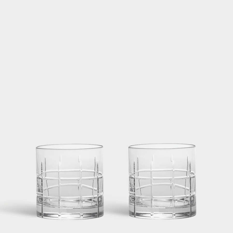 Two Orrefors Street Double Old Fashioned 13 oz tumblers, featuring a grid pattern reminiscent of Jan Johanssons design, are placed side by side against a plain white background.