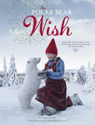 A girl in winter clothing kneels in the snow, holding a hat toward a baby polar bear, amid snow-covered trees that set the scene for this Nordic adventure. The book, *Polar Bear Wish* by Lori Evert, features Anja on her enchanting journey.