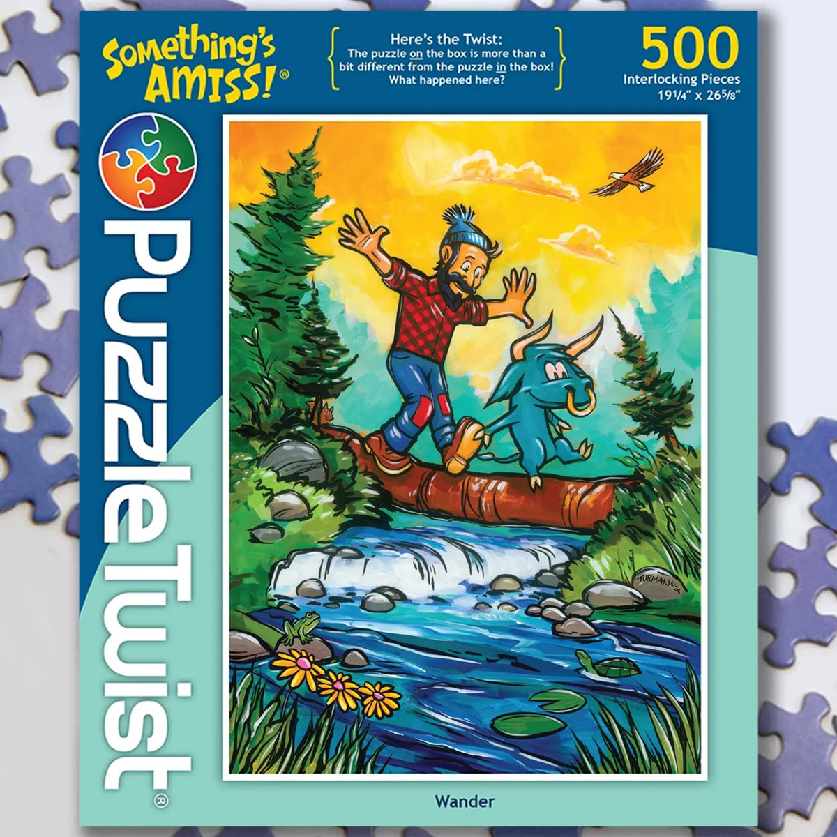 Minnesota jigsaw puzzle showing Paul Bunyan and his blue ox crossing a log over a stream in a green forest, with 500 pieces visible on the box.