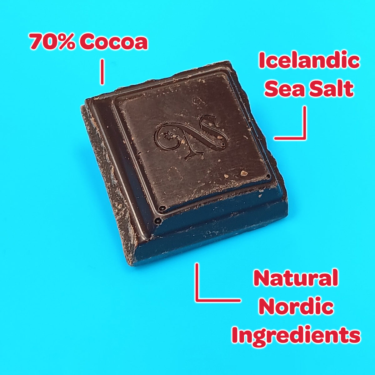 A square of Sirius Icelandic Chocolate—70% dark chocolate with sea salt and natural Nordic ingredients—rests on a bright blue background.