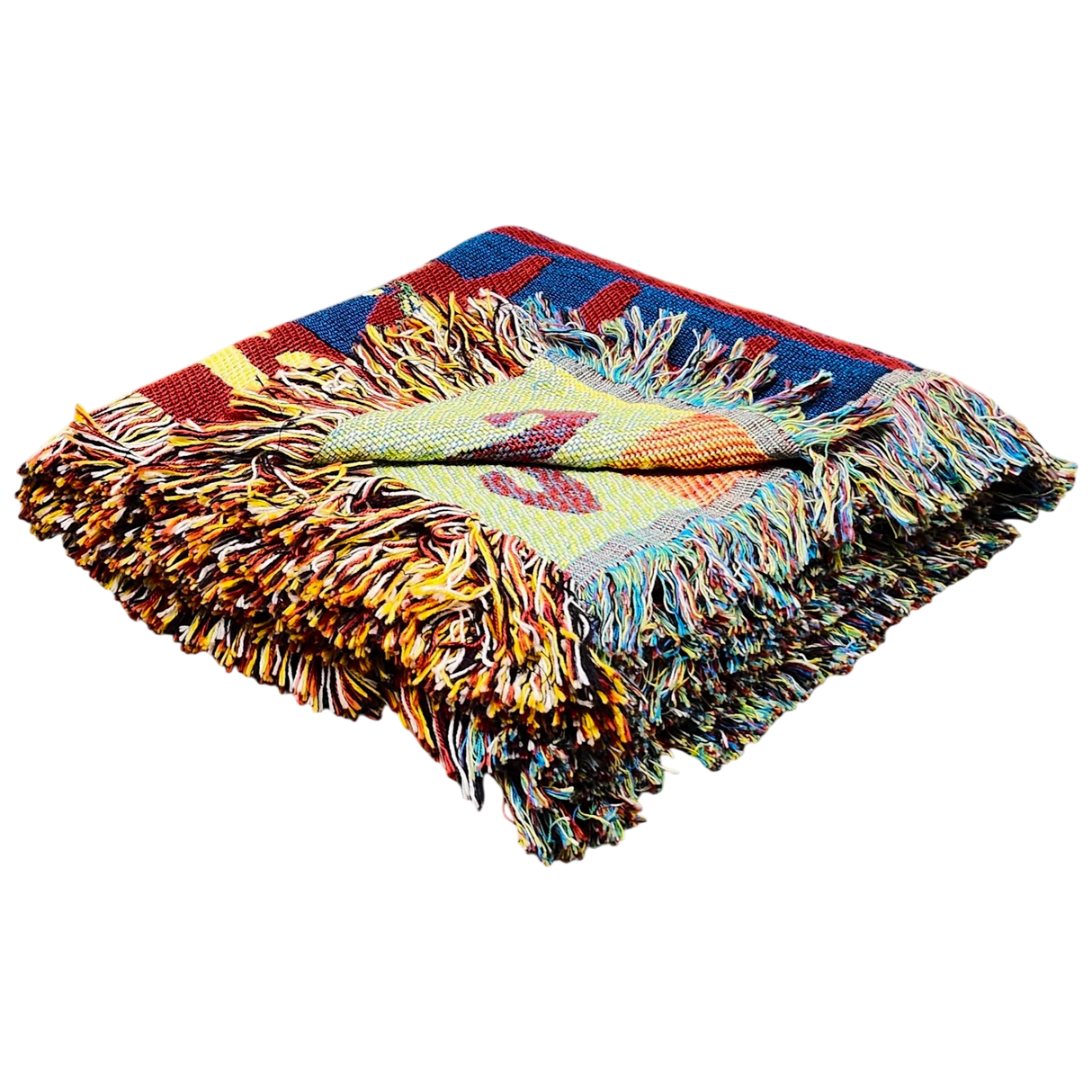 Folded multicolored woven blanket with fringed edges, displaying bright geometric patterns inspired by Scandinavian textiles.