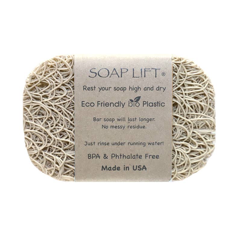 Introducing the Soap Lift: Soap Saver in bone, featuring an eco-friendly bioplastic tag and a proud Made in USA label. This innovative product is designed to keep your soap dry and residue-free. Enjoy a BPA and phthalate-free experience while supporting sustainable practices.