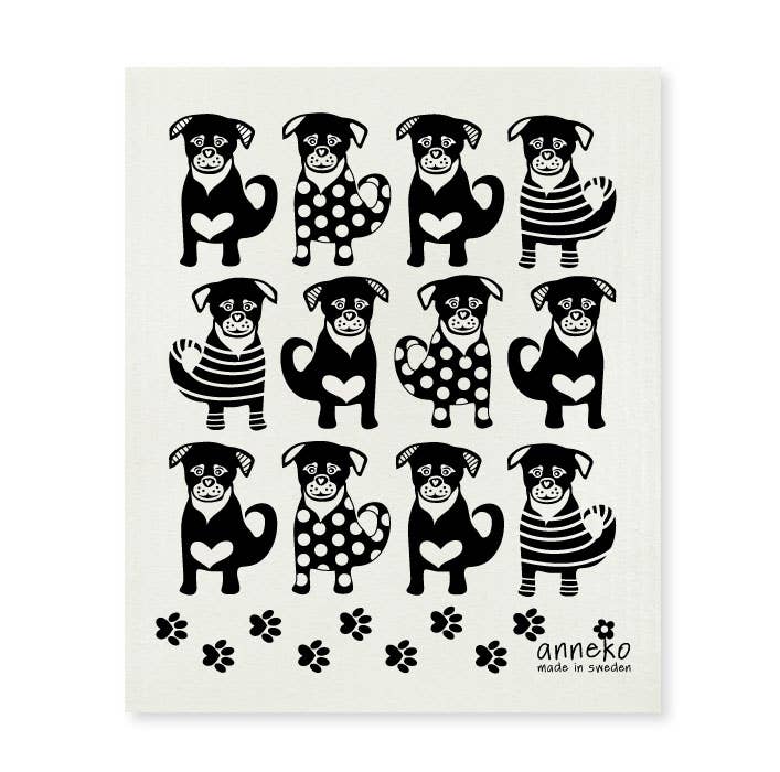 A grid of twelve black and white cartoon dogs with stripes and polka dots, each with a heart on its chest, plus paw prints. The Ella The Dog Swedish Dish Cloth by Anneko Design Sweden is an eco-friendly kitchen choice.