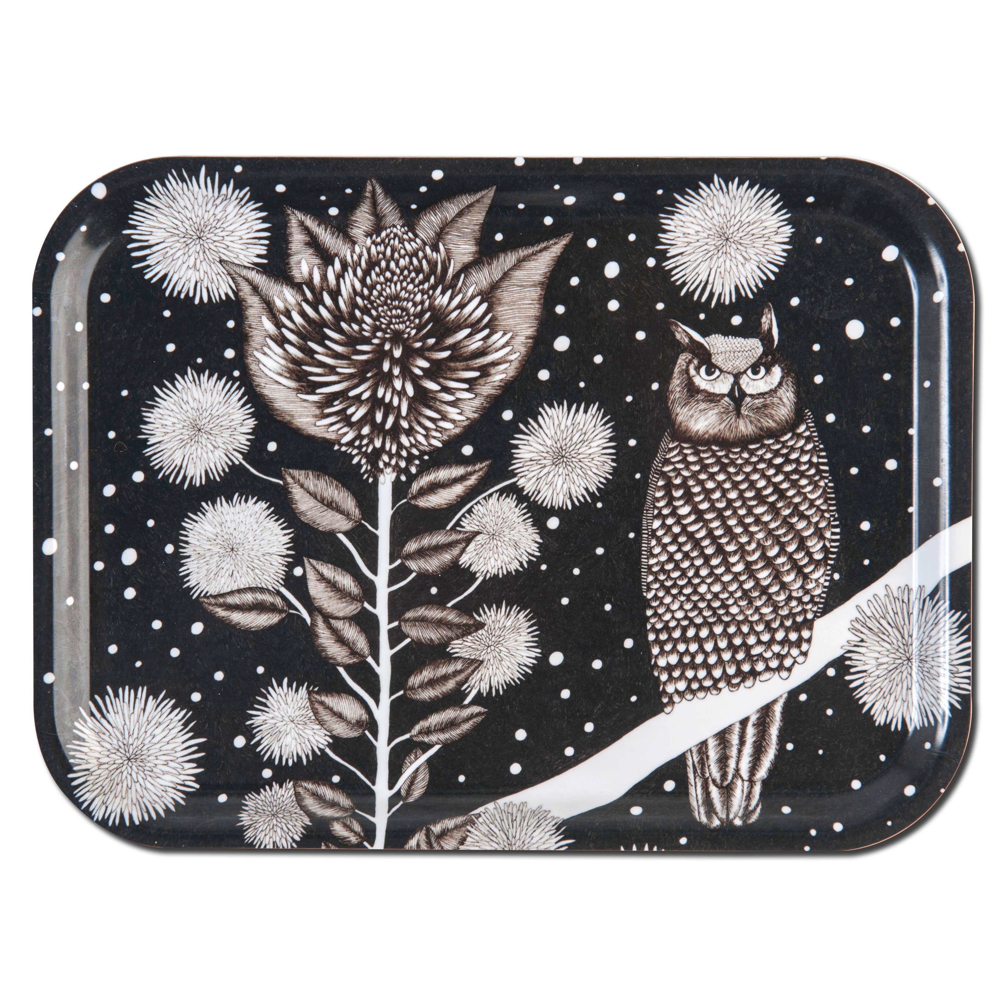 The Owl Tray (10.75" x 8") is a black, rectangular birchwood tray made in Sweden. It displays a white owl beside a large flower and round florals set against a starry night sky.