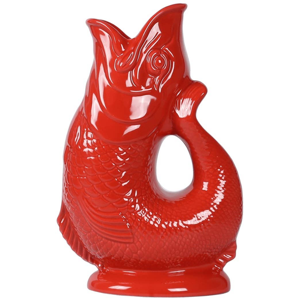 The Gluggle Jug: Red Fish Shaped Pitcher that Gluggles is an eye-catching ceramic pitcher with a fish shape, detailed scales, and a curved handle, perfect as unique novelty dinnerware.