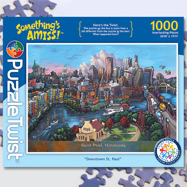 The PuzzleTwist: Downtown St Paul Artist Michael Birawer (1,000 Pieces) puzzle box features a whimsical and vibrant illustration of downtown, part of the captivating Somethings Amiss! series.