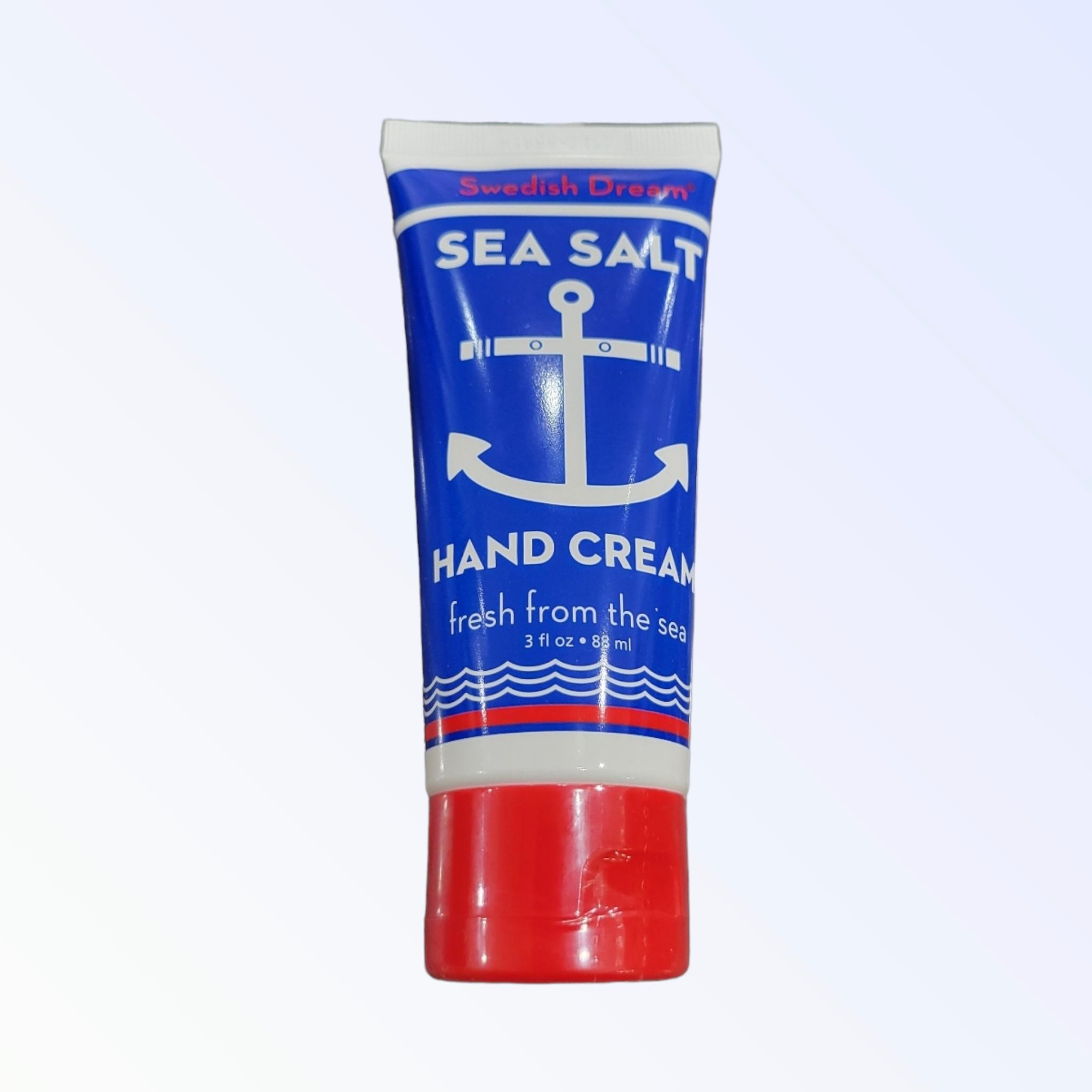 A 3oz tube of Swedish Dream Sea Salt Hand Cream, featuring a blue and white design with an anchor and red cap, labeled "fresh from the sea.