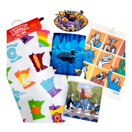 A collection of colorful illustrated prints and a tea towel featuring various cartoon and nature-themed designs.