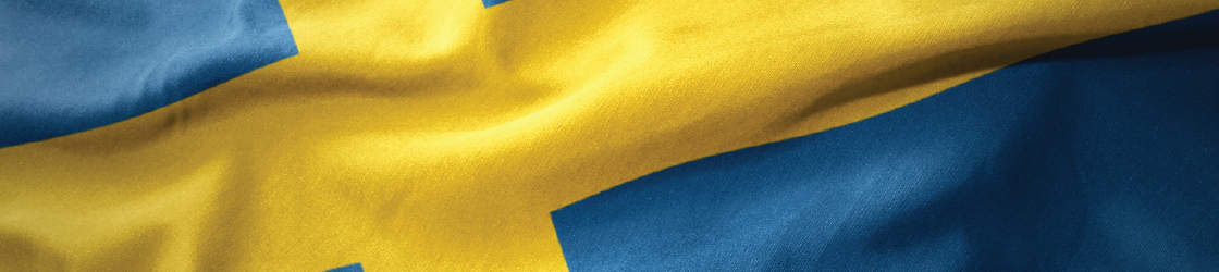 Swedish flag with a blue field and a yellow Nordic cross, slightly waving.