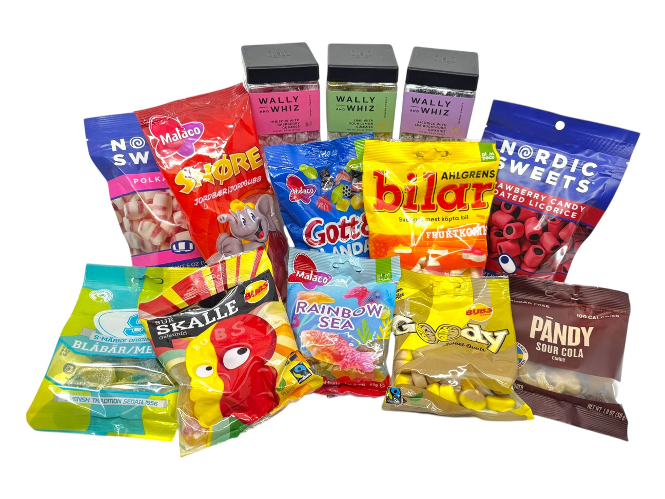 A variety of colorful packaged Scandinavian candies and sweets are arranged in rows, including brands like Malaco, Wally and Whiz, and Nordic Sweets.