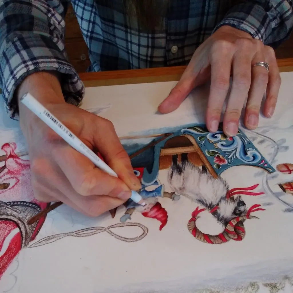 Person drawing a detailed and colorful illustration of a goat using colored pencils, wearing a plaid shirt.