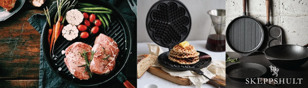 Assorted cast iron cookware, including skillets and waffle irons, are arranged on the ground with a leafy background.