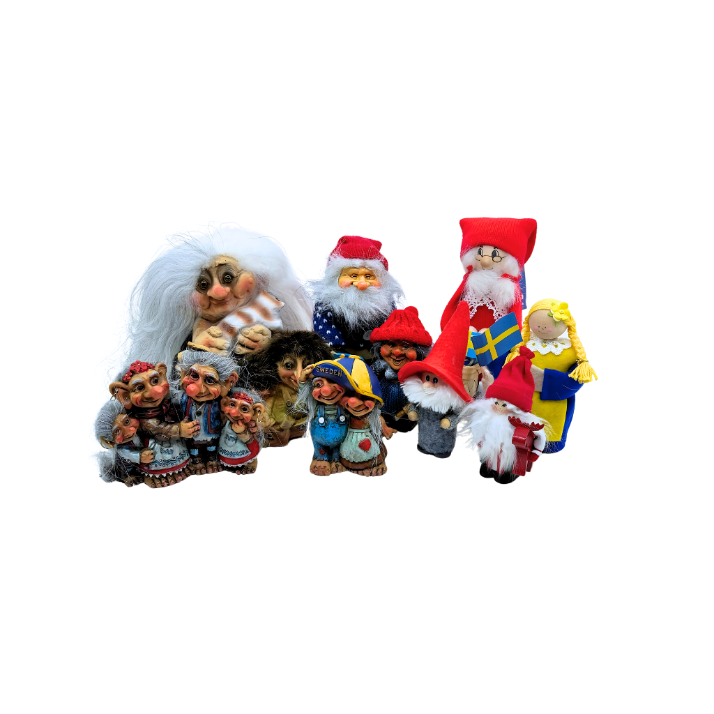 A collection of whimsical troll and gnome figurines in various outfits and hats, including some in Christmas-themed attire.