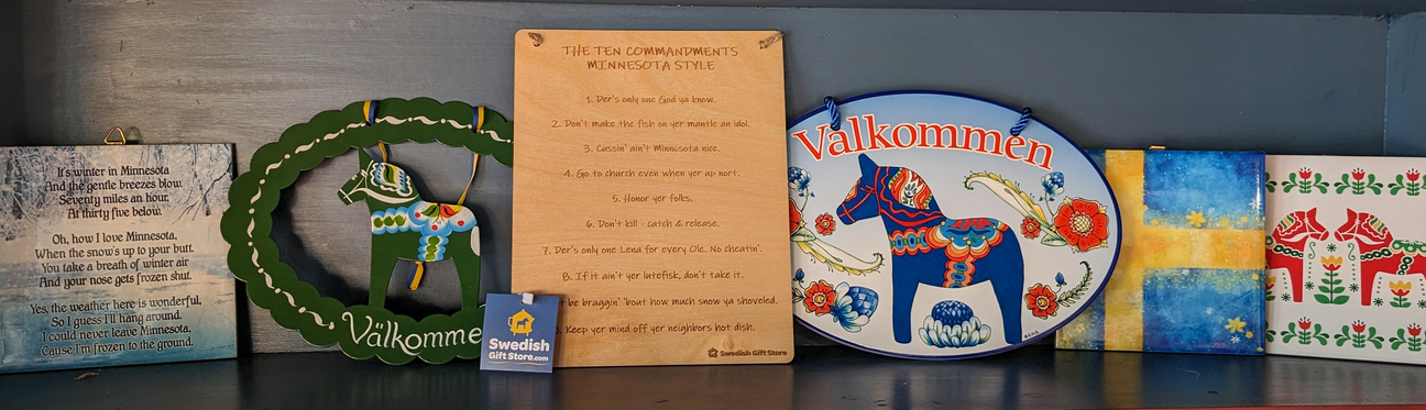 A shelf displays decorative items with Swedish motifs, including dala horses and plaques. One features Valkommen text; another lists The Ten Commandments Minnesota Style.