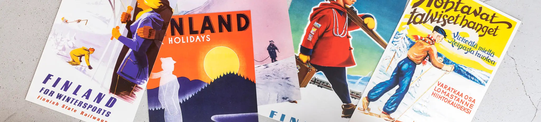 Four vintage travel posters promoting Finland for winter sports and holidays, featuring skiing and snowy landscapes.