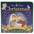 The Book: First Christmas Lift-a-Flap Baby Jesus Board Book features illustrated Mary, Joseph, and baby Jesus with stars, an angel, and a dove—a perfect First Christmas board book for children.