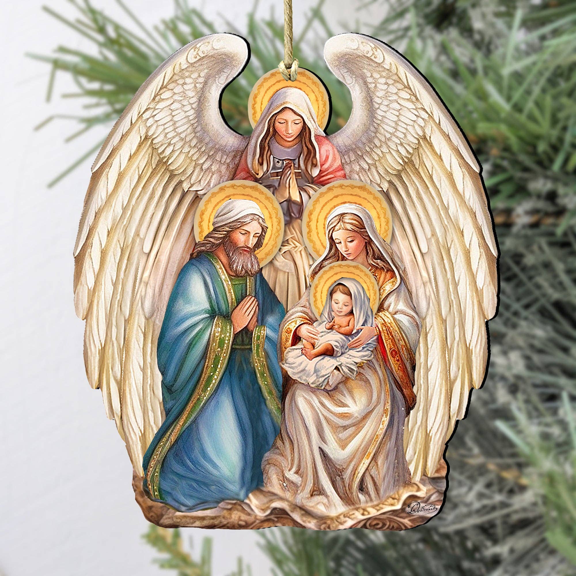 Introducing the "Ornament: Nativity with Angel Wooden Ornaments G.Debrekht Christmas," a beautifully handcrafted keepsake that depicts an angel above Joseph, Mary, and baby Jesus, set against a green leafy background. It's the perfect addition to enhance your Christmas decor.