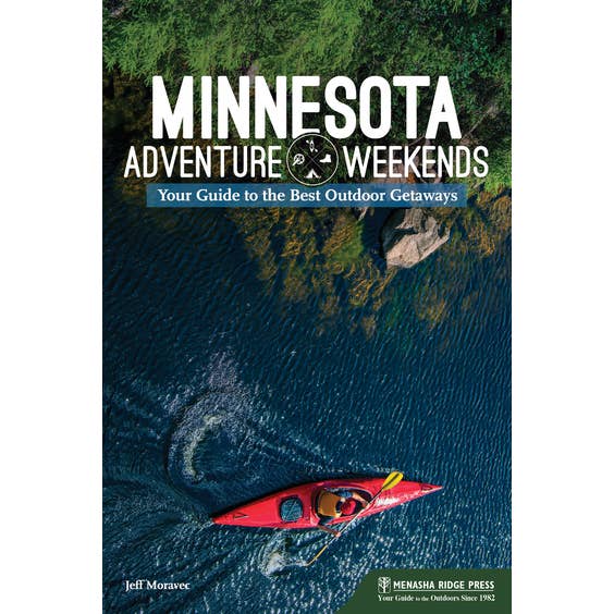 Cover of the book titled "Minnesota Adventure Weekends," showcasing a kayaker paddling on a blue lake encircled by vibrant green vegetation.