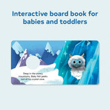 A plush baby yeti finger puppet poking through a circular cutout in a board book illustrated with a crystal cave design.