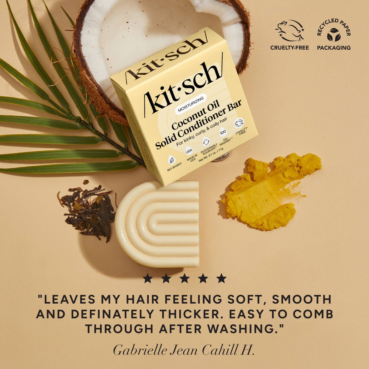 A Kitsch Coconut Oil Shampoo & Conditioner Bar Combo for Dry Damaged Hair (2 x 2.7oz bars), open coconut, a white textured accessory, loose tea leaves, and yellow powder are on a beige surface with a customer testimonial below.